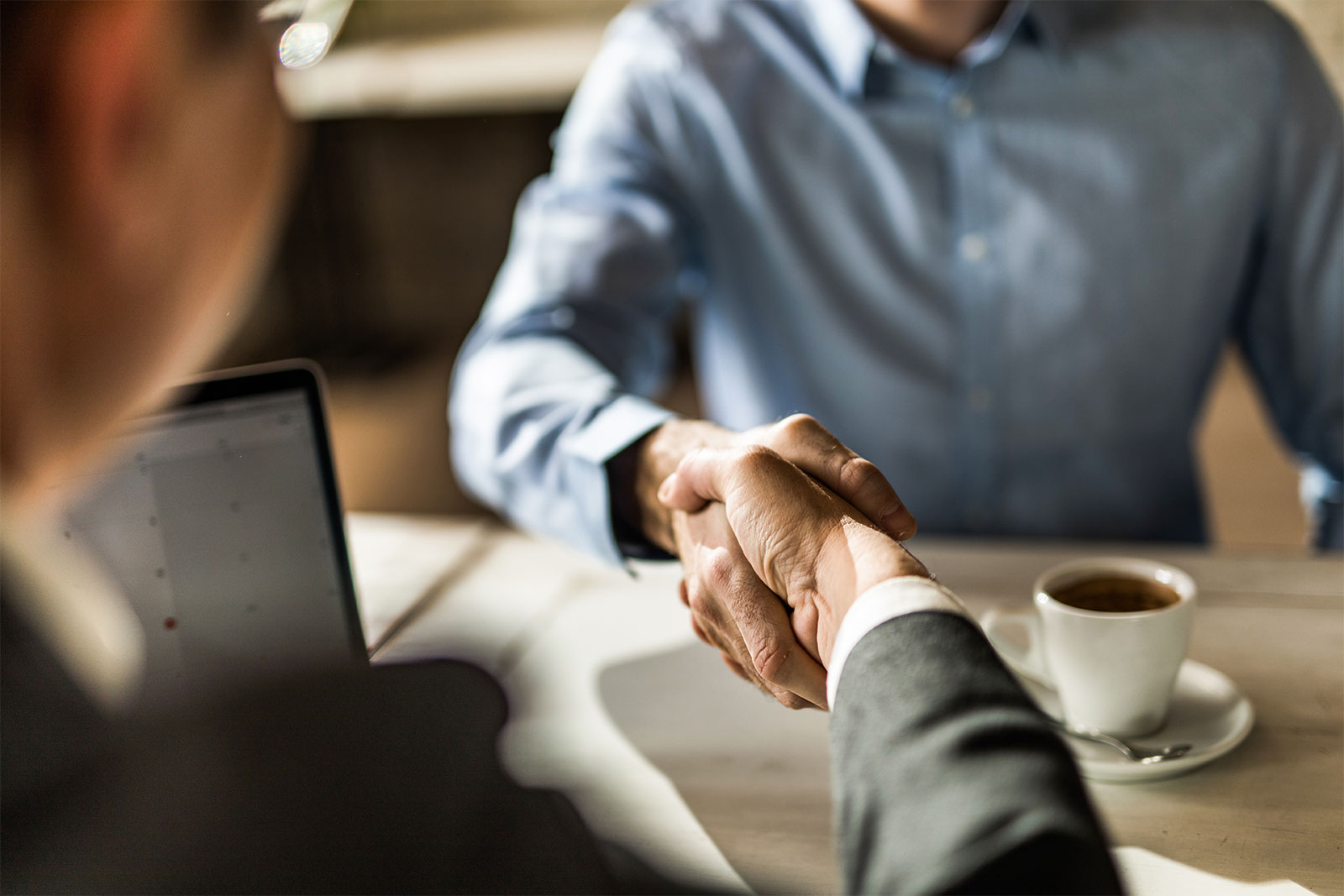 Image of two guys shaking hands