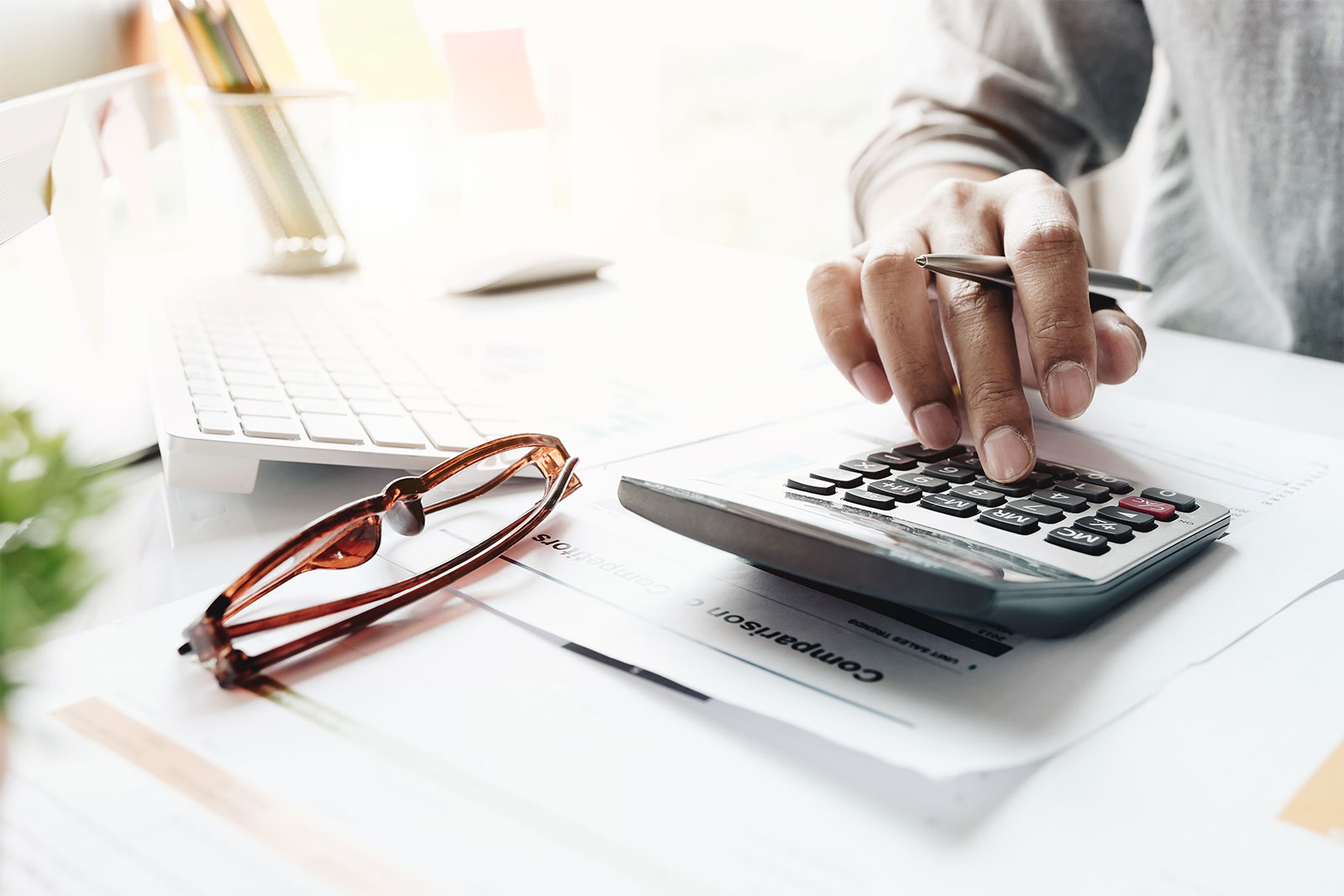 Image of man using a calculator